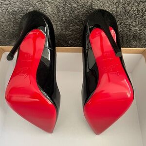 Christian Louboutin Black Patent Heels with the iconic Red Soles